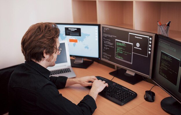 male-programmer-working-desktop-computer-with-many-monitors-office-software-develop-company-website-design-programming-coding-technologies-1040180-7096 male-programmer-working-desktop-computer-with-many-monitors-office-software-develop-company-website-design-programming-coding-technologies-1040180-7096